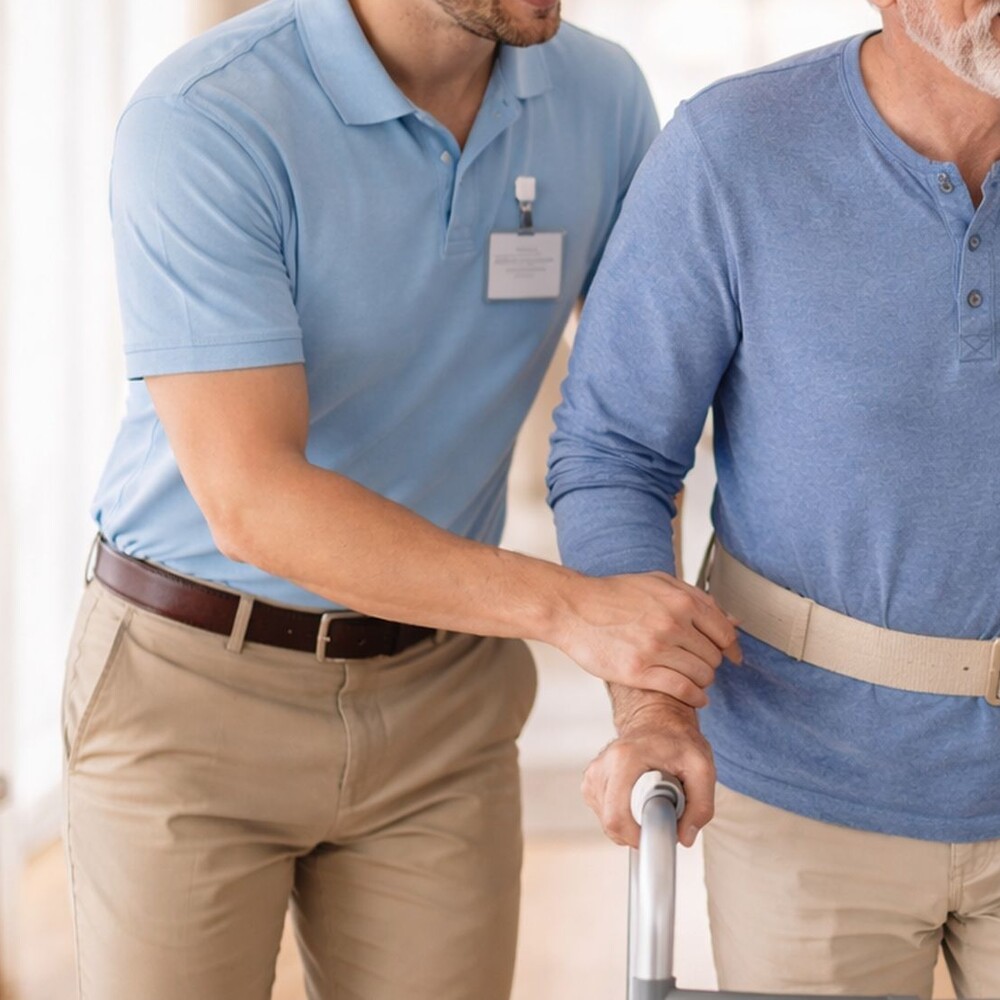 Licensed physical therapist guiding a home exercise session with a patient in Las Vegas